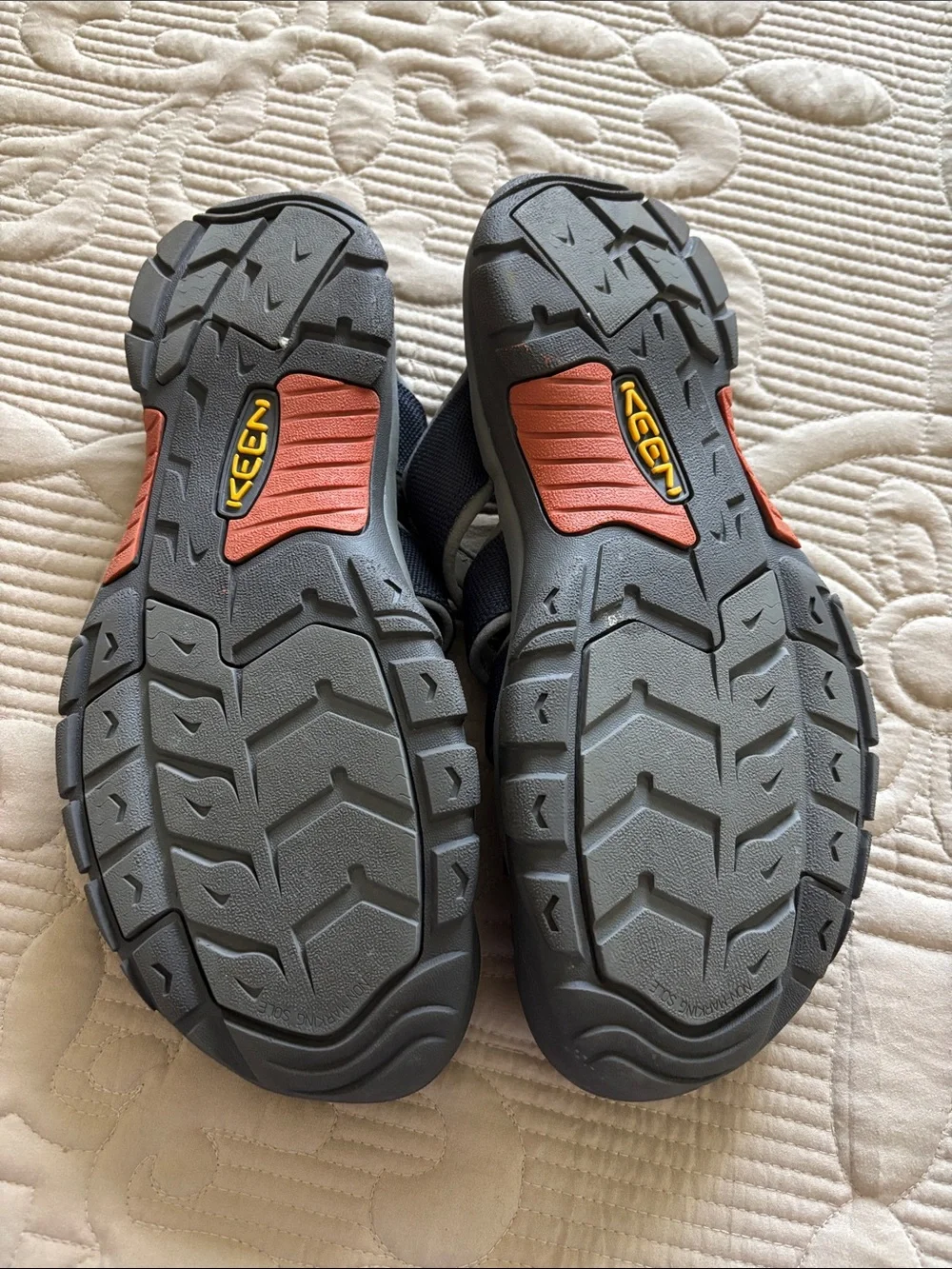 Keen Men's Closed-Toe Slide Sandals in Black with Orange Accents
